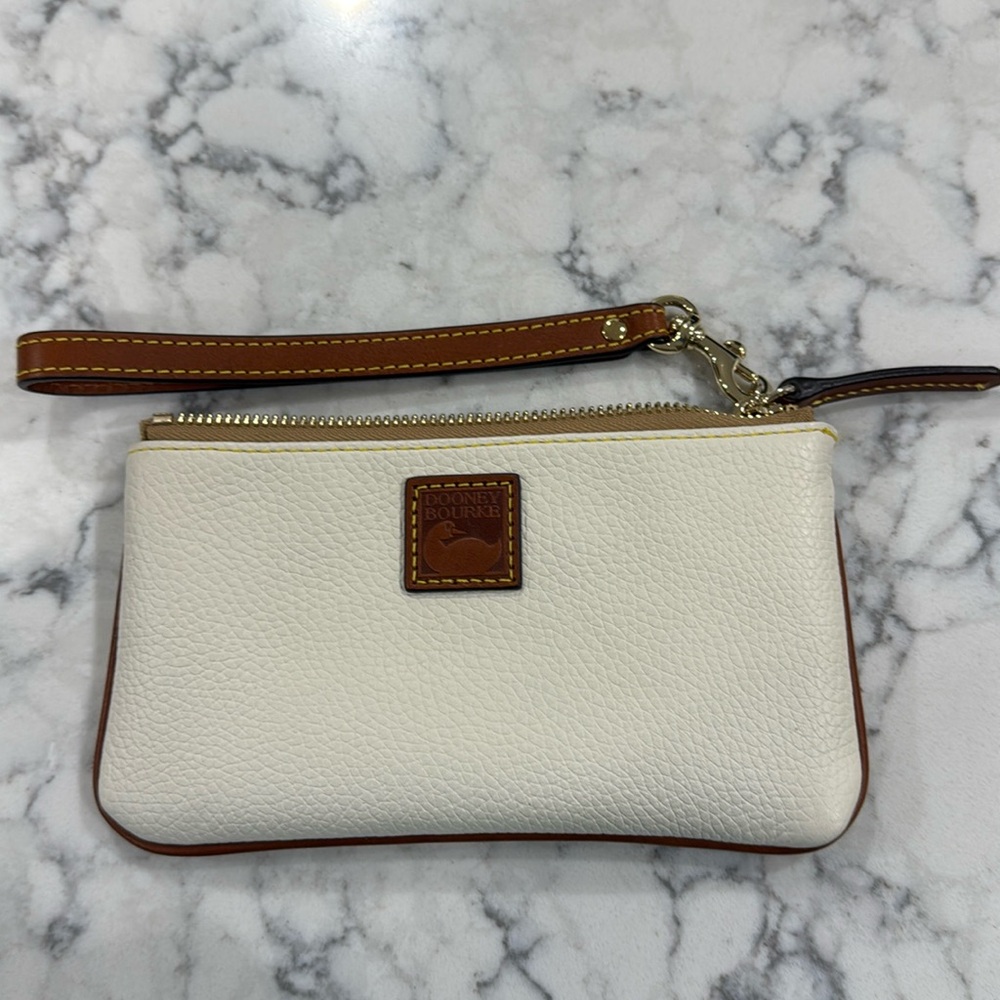 ￼New without tag Dooney and Bourke large wristlet wallet. Creamy white.